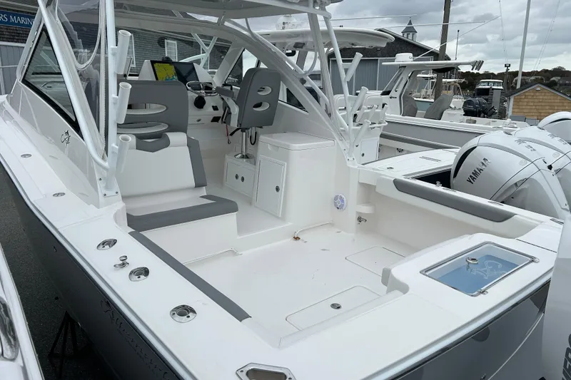 Slide: The Image of 2024 Albemarle 30 Express boat with spacious cockpit and dual Yamaha engines. - 26