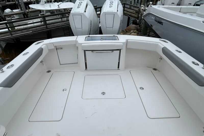 Slide: The Image of 2024 Albemarle 30 Express boat deck with storage compartments and seating. - 29