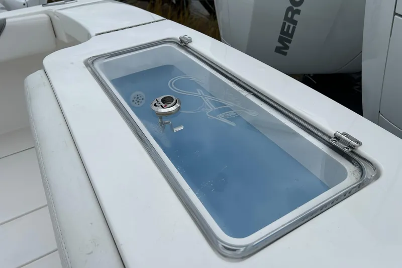 Slide: The Image of 2024 Albemarle 30 Express boat livewell with transparent lid and latch. - 31