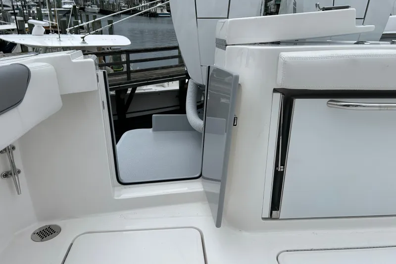 Slide: The Image of 2024 Albemarle 30 Express boat interior with open hatch and sleek design. - 33