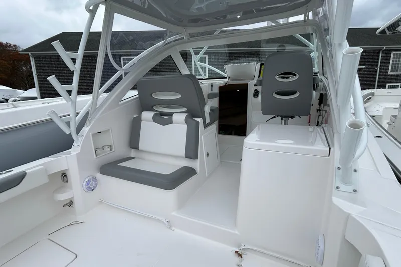 Slide: The Image of 2024 Albemarle 30 Express boat interior with seating and helm station. - 36