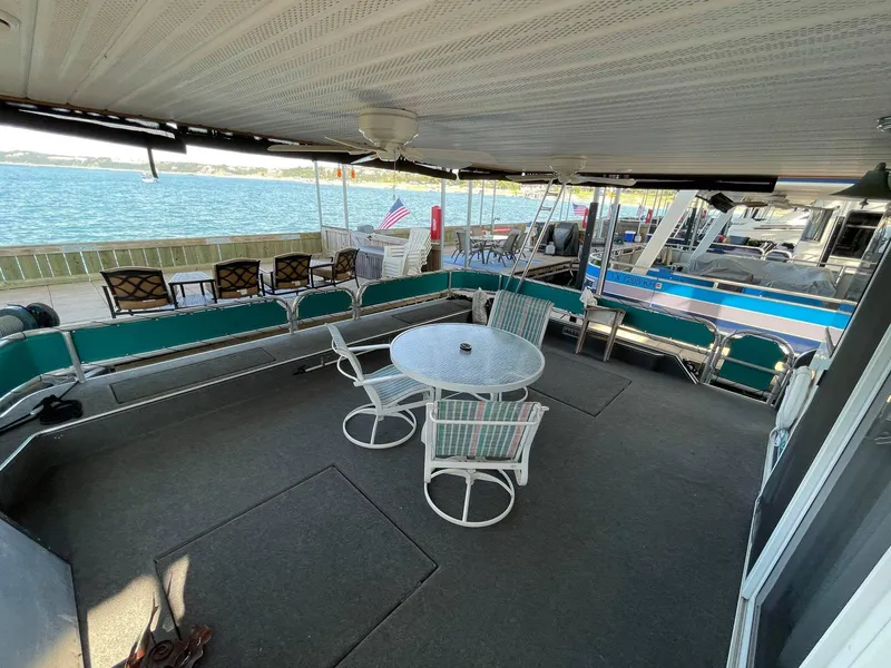 Slide: The Image of 1998 Sumerset 86' by 18' houseboat with spacious deck and lake view. - 3