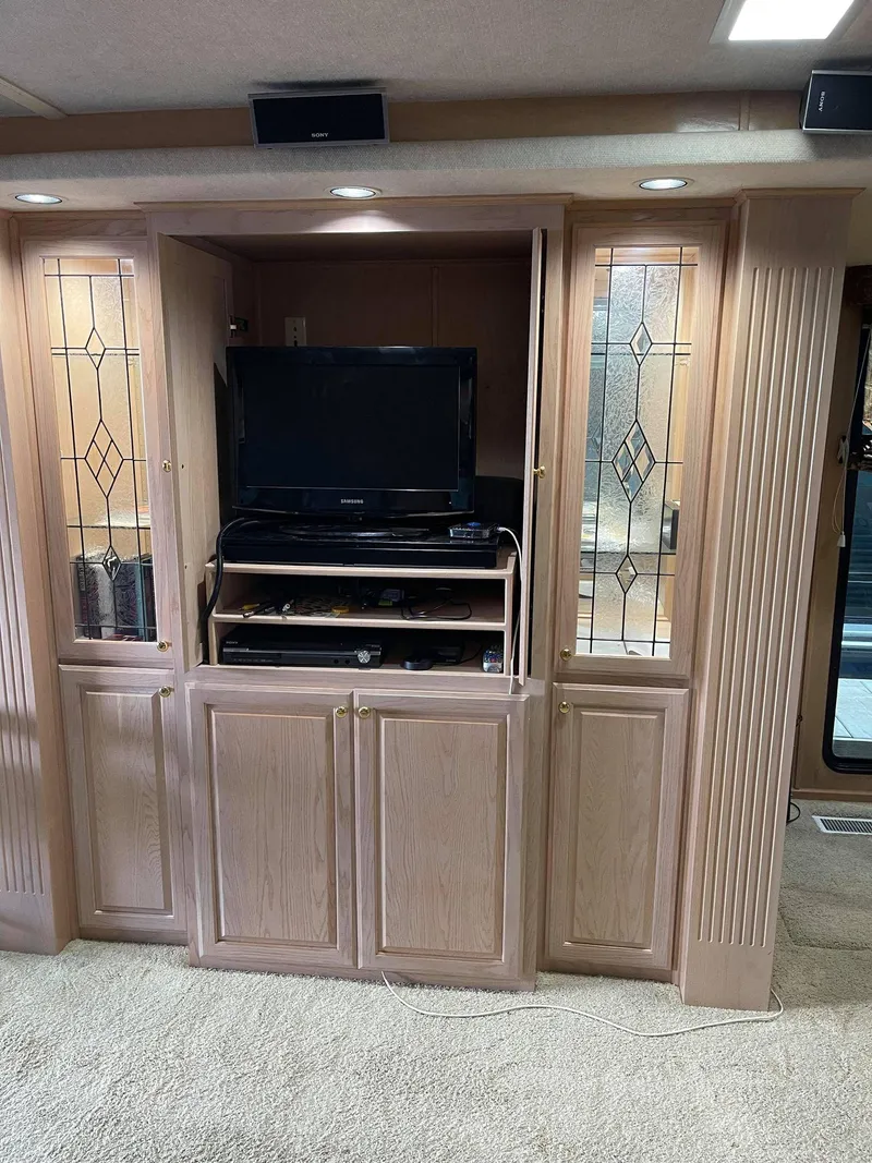 Slide: The Image of Entertainment center in a 1998 Sumerset 86' by 18' houseboat. - 7