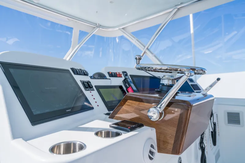 Slide: The Image of 2025 Henriques 50 Sportfisherman helm with advanced navigation systems and controls. - 15