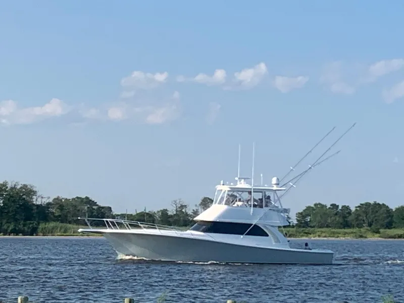 Slide: The Image of 2025 Henriques 50 Sportfisherman cruising on a calm river. - 21