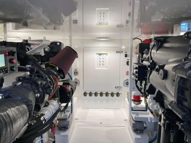 Slide: The Image of Engine room of 2025 Henriques 50 Sportfisherman yacht with visible machinery and components. - 24