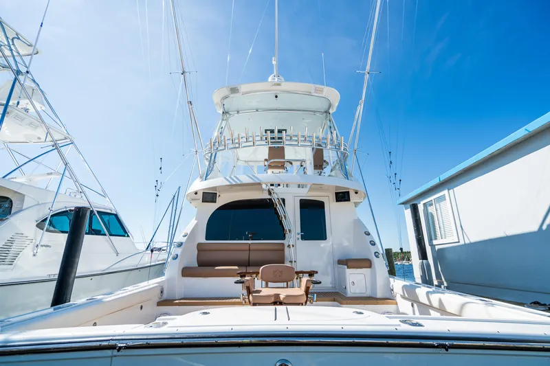 Slide: The Image of 2025 Henriques 50 Sportfisherman yacht with spacious deck and fishing chair. - 4