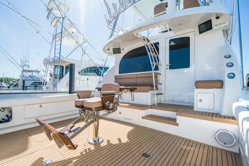 Slide: The Image of 2025 Henriques 50 Sportfisherman yacht with teak deck and fishing chair. - 5