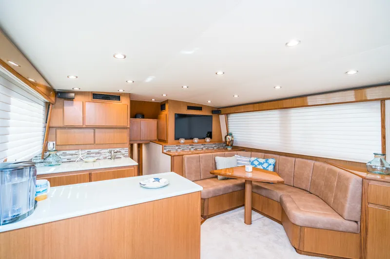 Slide: The Image of Interior of 2025 Henriques 50 Sportfisherman with modern kitchen and cozy seating area. - 6