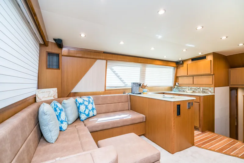 Slide: The Image of Interior of 2025 Henriques 50 Sportfisherman with modern kitchen and cozy seating area. - 7