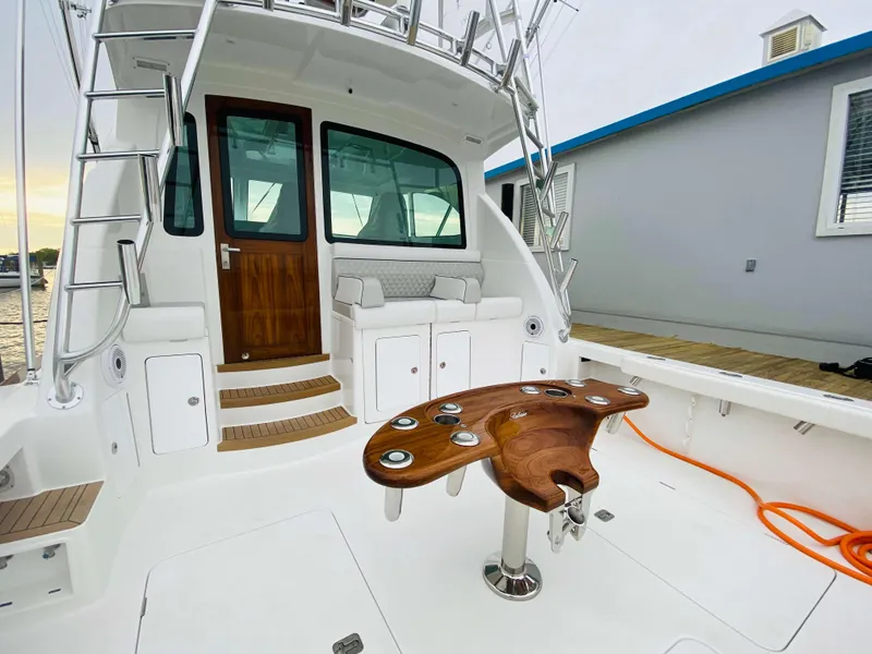 Slide: The Image of 2025 Henriques 42 EXHTB boat with wooden deck and fishing chair. - 12
