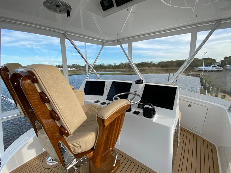Slide: The Image of 2025 Henriques 42 EXHTB boat helm with modern navigation equipment and comfortable seating. - 30