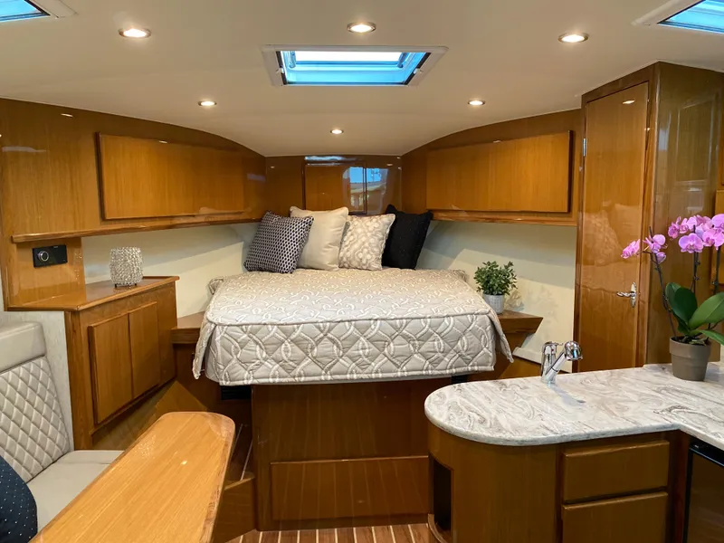 Slide: The Image of Luxurious interior of 2025 Henriques 42 EXHTB yacht with cozy bed and modern amenities. - 23