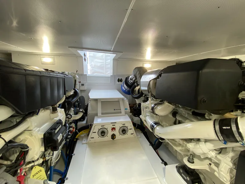 Slide: The Image of Engine room of 2025 Henriques 42 EXHTB boat with dual engines and control panel. - 29
