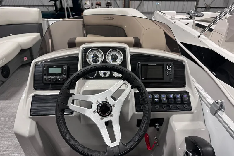 Slide: The Image of 2026 Sylvan Mirage 818 Cruise dashboard with steering wheel and control panel. - 11