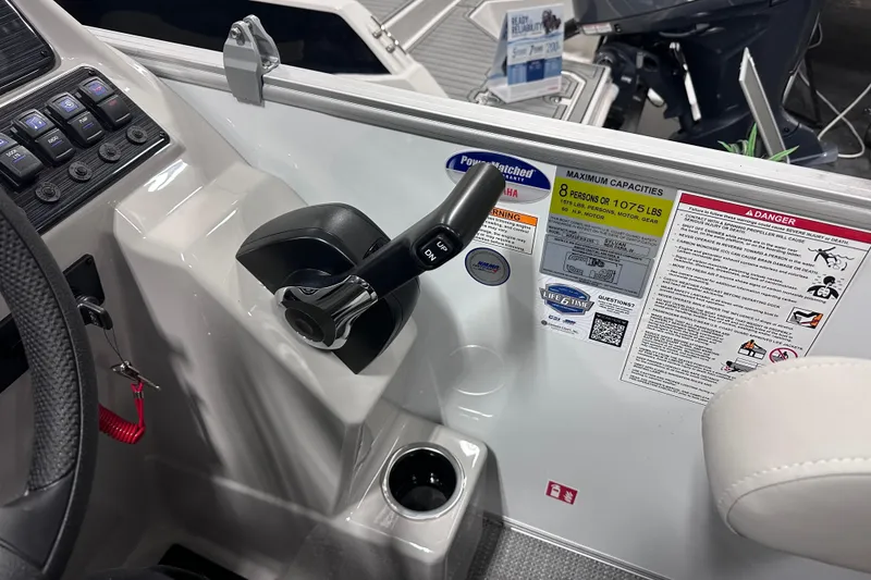 Slide: The Image of Control panel of 2026 Sylvan Mirage 818 Cruise boat with capacity and safety labels. - 13