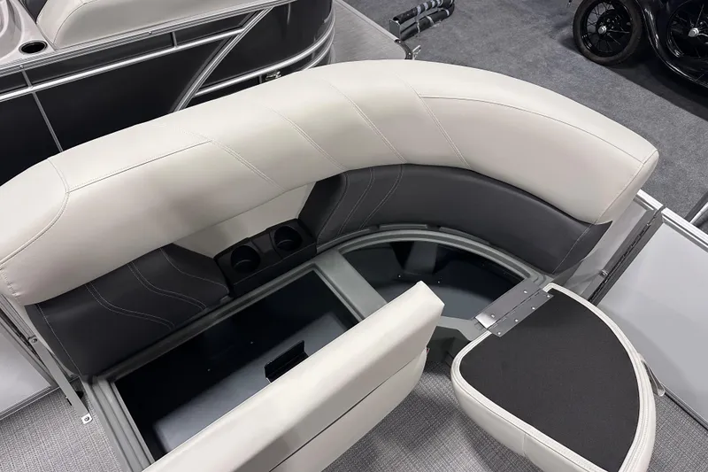 Slide: The Image of 2026 Sylvan Mirage 818 Cruise boat interior with storage and cup holders. - 15