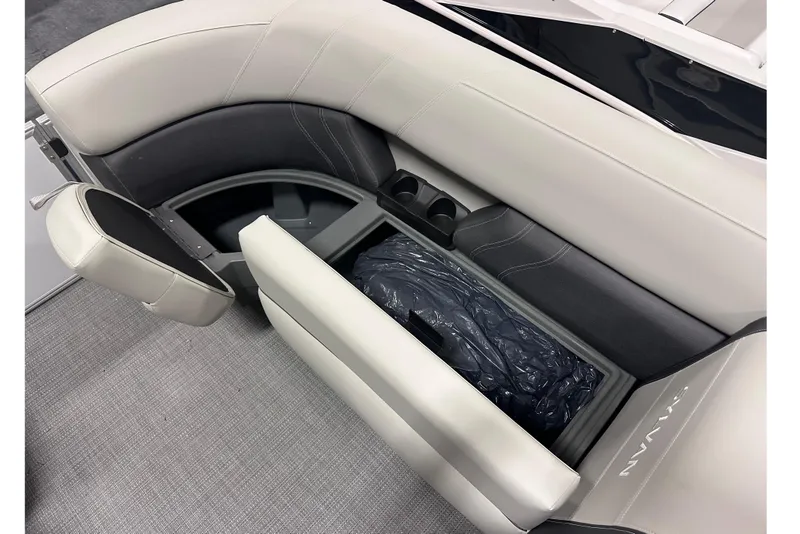 Slide: The Image of 2026 Sylvan Mirage 818 Cruise boat interior with storage compartment and cup holders. - 16