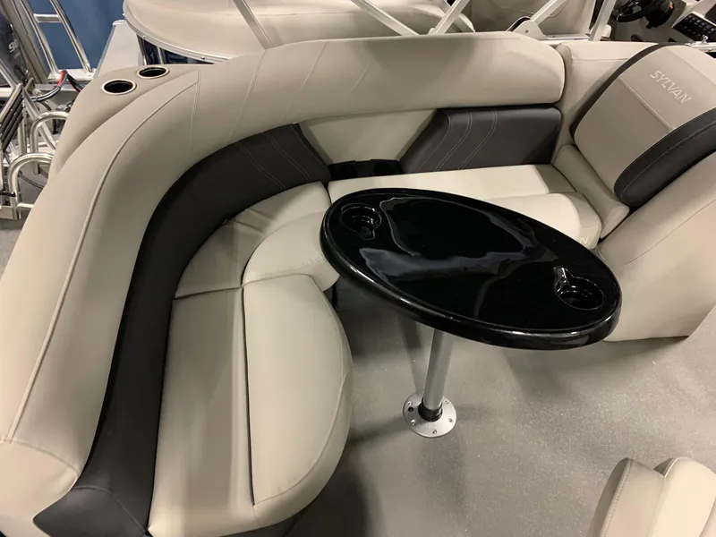 Slide: The Image of Interior of 2026 Sylvan Mirage 818 Cruise with elegant seating area. - 9