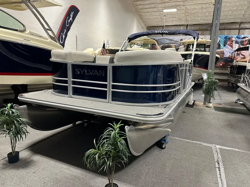 The Image of 2026 Sylvan Mirage 8520 LZ pontoon boat displayed indoors, featuring sleek design and modern amenities. - 0