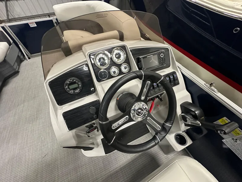 Slide: The Image of Steering console of 2026 Sylvan Mirage 8520 LZ pontoon boat with modern controls and gauges. - 11