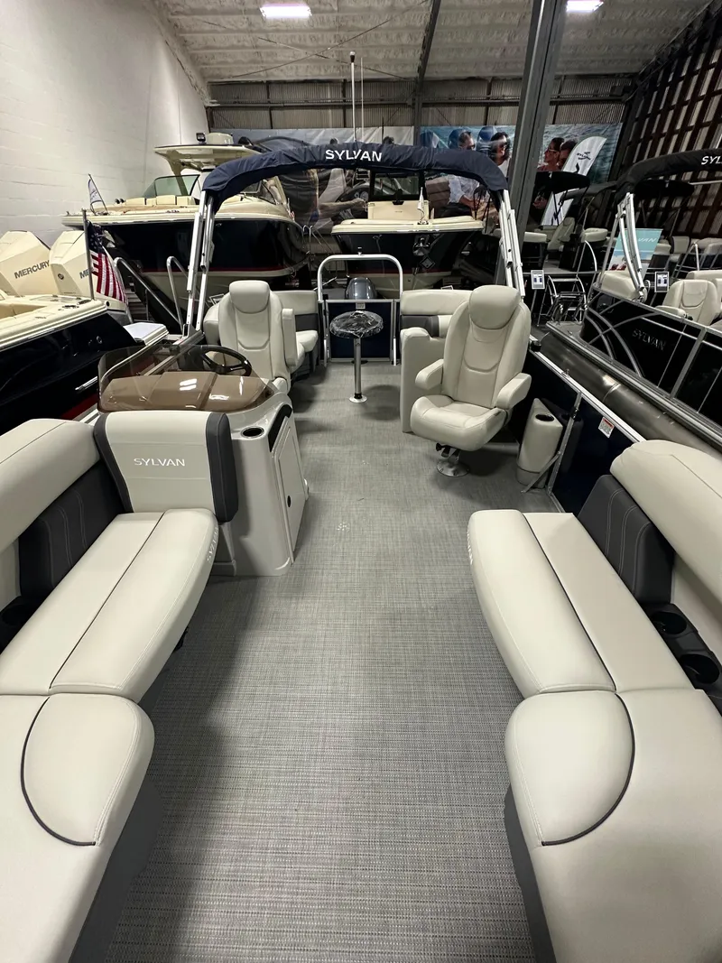 Slide: The Image of 2026 Sylvan Mirage 8520 LZ pontoon boat interior with spacious seating and modern design. - 15