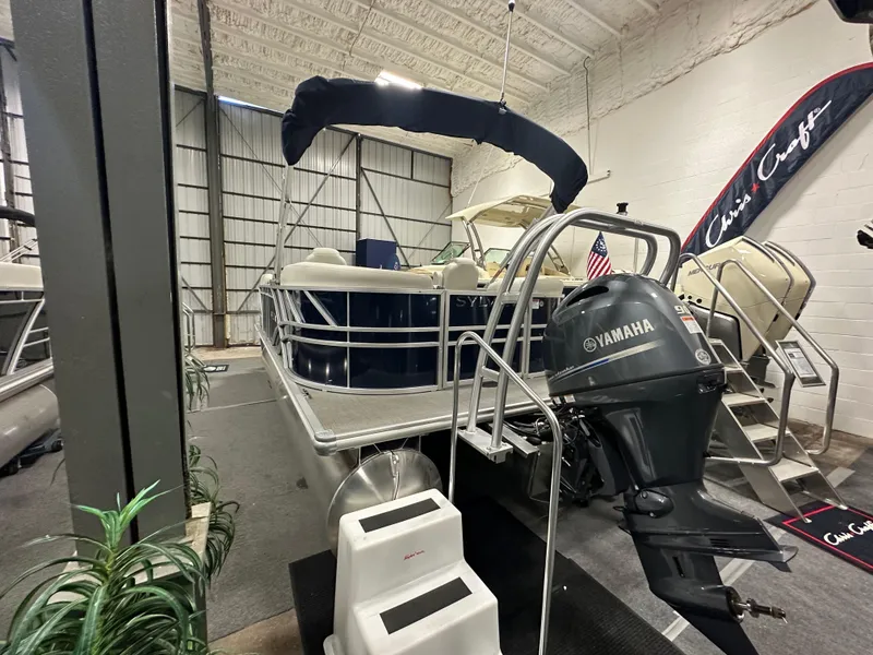 Slide: The Image of 2026 Sylvan Mirage 8520 LZ pontoon boat with Yamaha motor in showroom. - 3
