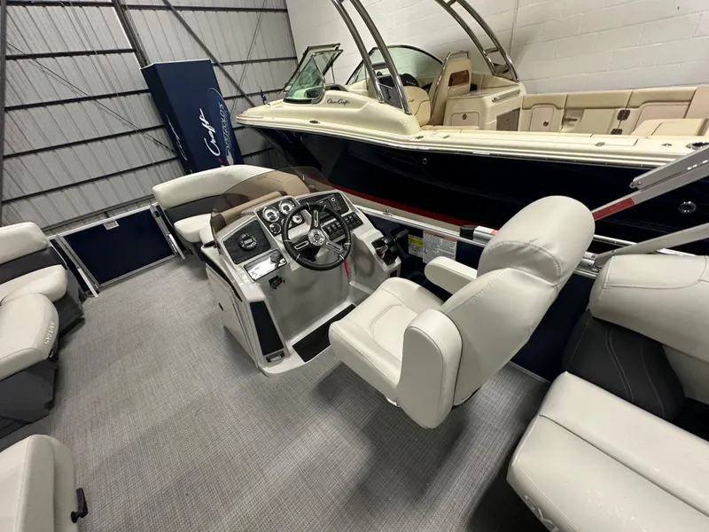 Slide: The Image of 2026 Sylvan Mirage 8520 LZ pontoon boat interior with luxurious seating and modern dashboard. - 9
