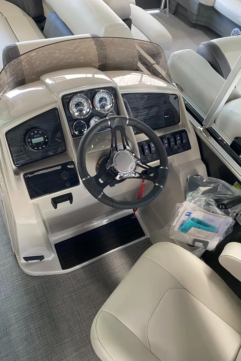 Slide: The Image of 2022 Sylvan Mirage 8522 Cruise boat dashboard and steering wheel. - 10