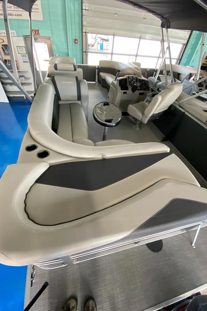 Slide: The Image of 2022 Sylvan Mirage 8522 Cruise pontoon boat interior with plush seating. - 2