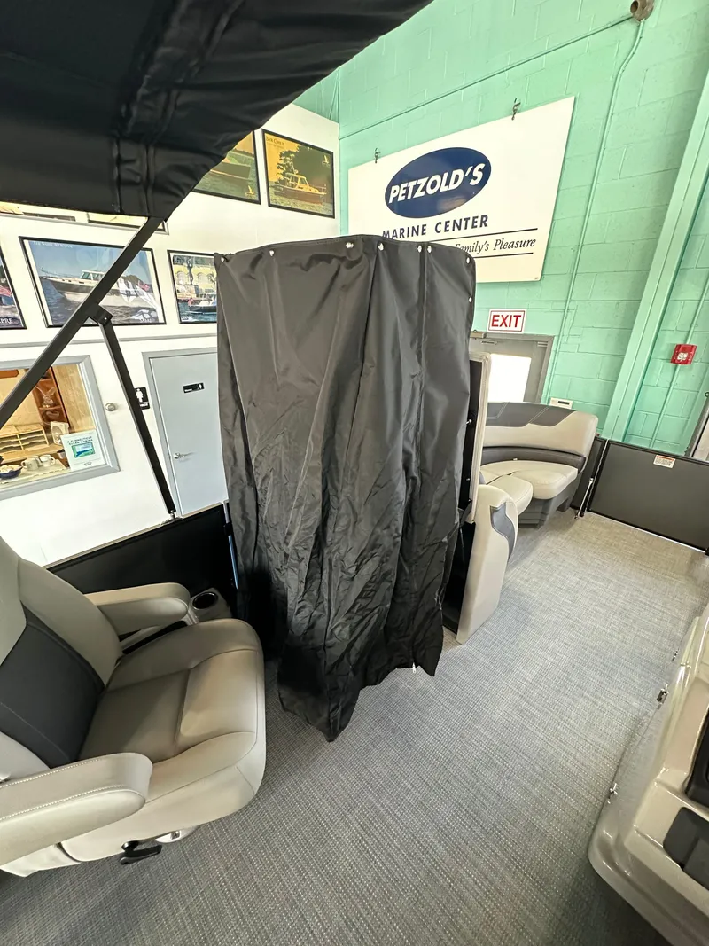 Slide: The Image of 2025 Sylvan Mirage L-1 LZ boat seat with storage compartment open. - 10