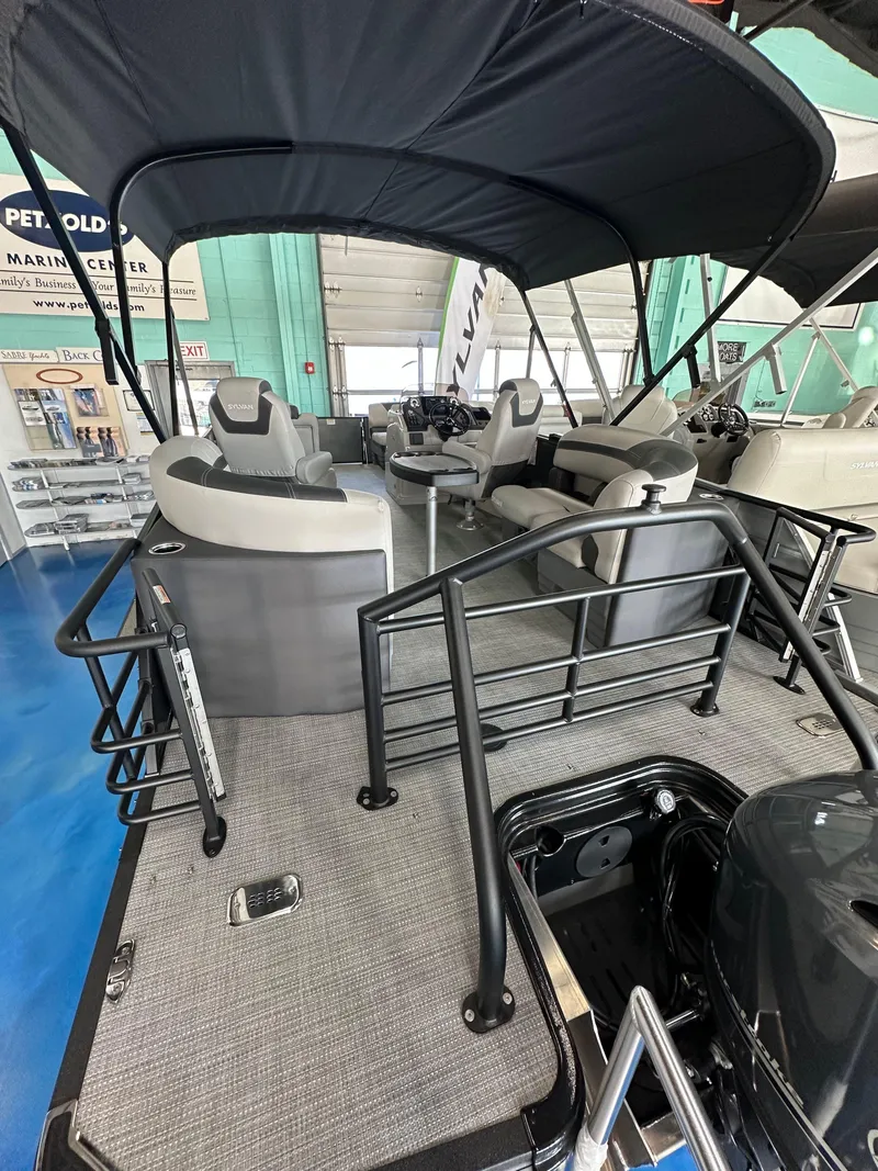 Slide: The Image of 2025 Sylvan Mirage L-1 LZ pontoon boat with Yamaha 115 engine in showroom. - 3