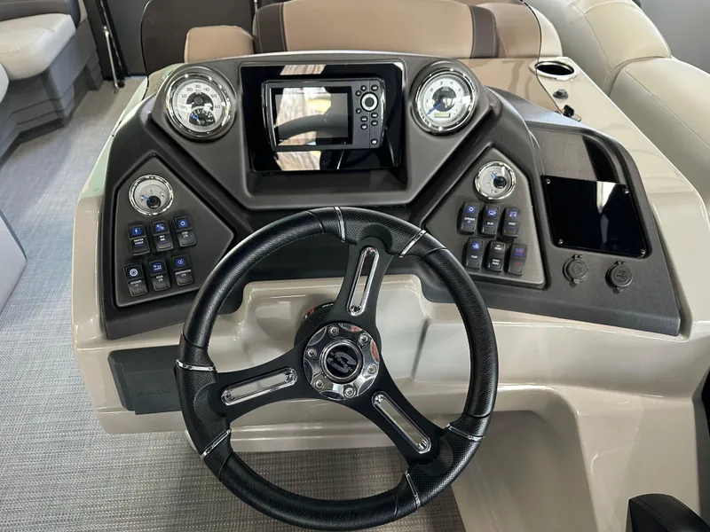 Slide: The Image of 2025 Sylvan Mirage L-1 LZ boat interior with modern helm and comfortable seating. - 6