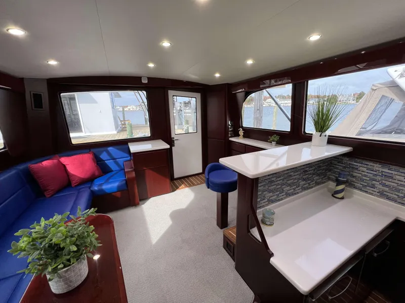 Slide: The Image of Interior of 2025 Henriques 42 Flybridge yacht with modern seating and decor. - 13