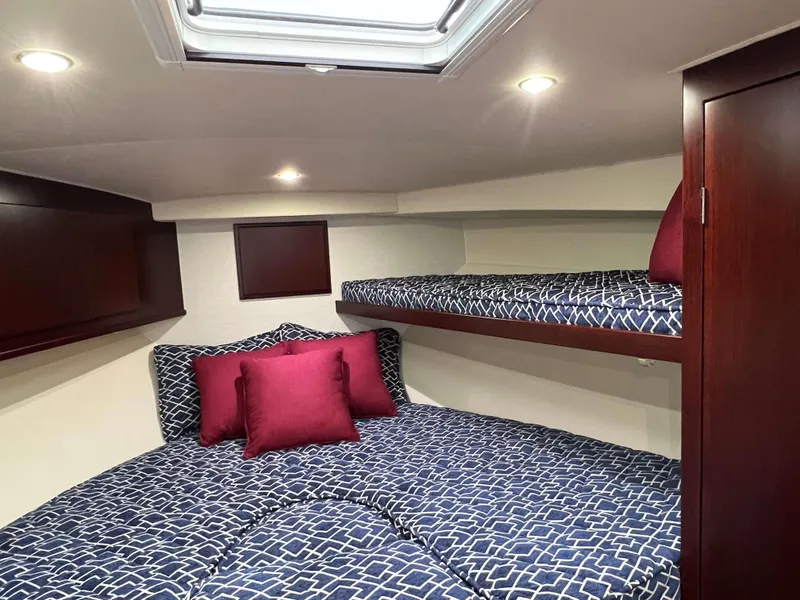 Slide: The Image of Luxurious cabin interior of 2025 Henriques 42 Flybridge with stylish bedding and modern lighting. - 19