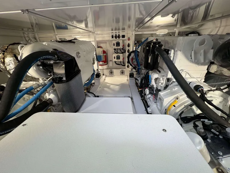 Slide: The Image of Engine room of 2025 Henriques 42 Flybridge, showcasing modern equipment and wiring. - 38