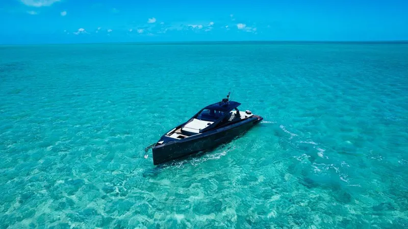 Slide: The Image of Luxury Maori 54 yacht cruising in clear turquoise waters, 2020 model. - 1