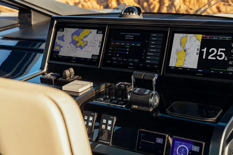 Slide: The Image of Maori 54 yacht 2020 model dashboard with navigation screens and controls. - 18