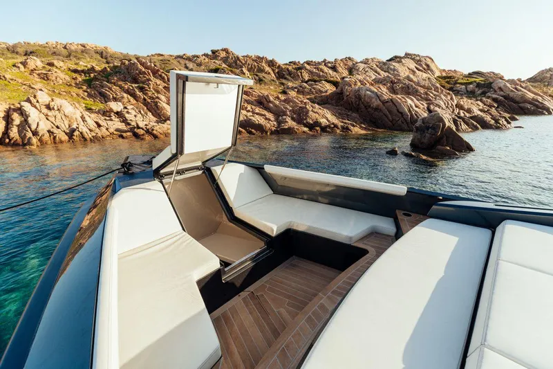 Slide: The Image of Maori 54 yacht 2020 model, luxury seating area with scenic rocky coastline. - 19
