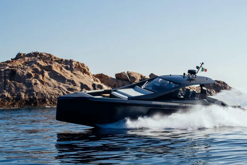 Slide: The Image of Maori 54 yacht cruising near rocky coastline, 2020 model. - 7