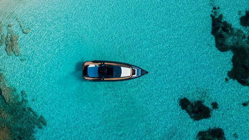Slide: The Image of Aerial view of a 2020 Maori 54 yacht on clear turquoise water. - 9