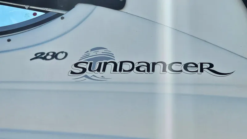 Slide: The Image of 2003 Sea Ray 280 Sundancer boat logo and model name. - 22