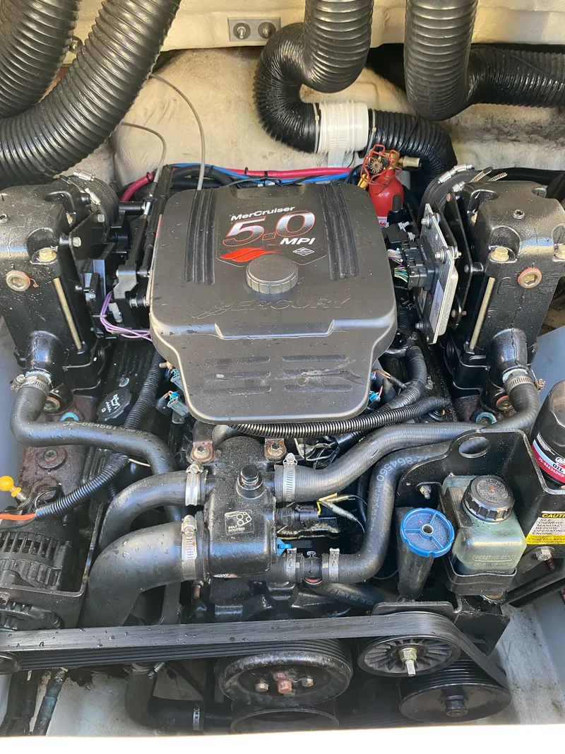Slide: The Image of 2006 Sea Ray 200 Sundeck engine, detailed view of MerCruiser 5.0 MPI components. - 12