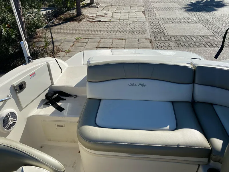 Slide: The Image of 2006 Sea Ray 200 Sundeck boat interior with seating and speaker. - 7