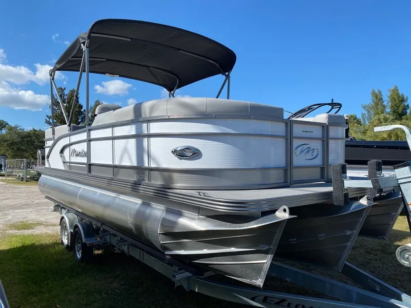 Slide: The Image of 2022 Manitou 23 Encore RF VP pontoon boat on trailer. - 0