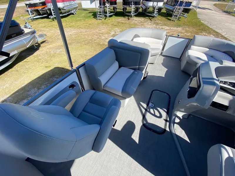 Slide: The Image of 2022 Manitou 23 Encore RF VP pontoon boat interior with gray seating. - 13