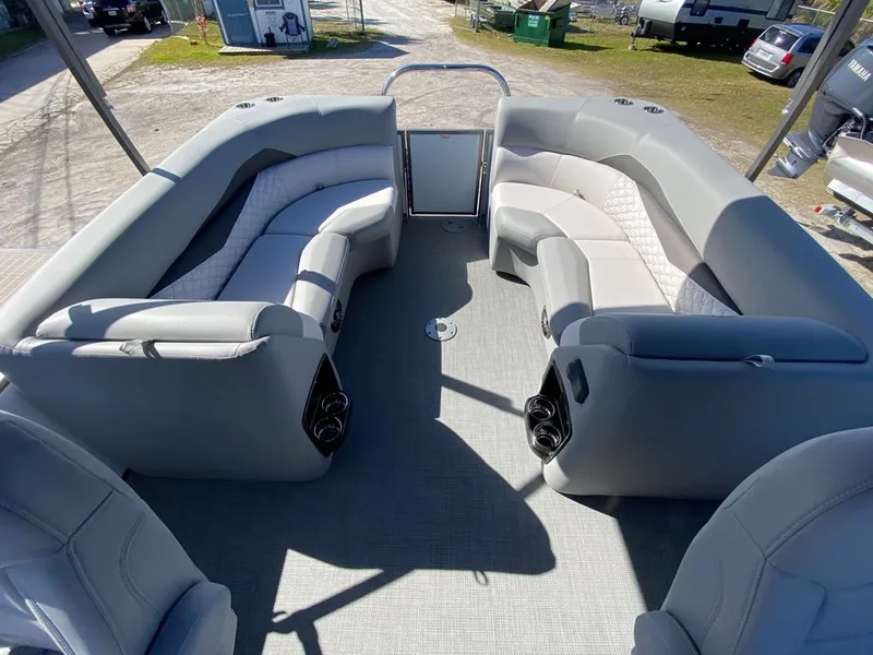Slide: The Image of 2022 Manitou 23 Encore RF VP boat interior with spacious seating. - 14
