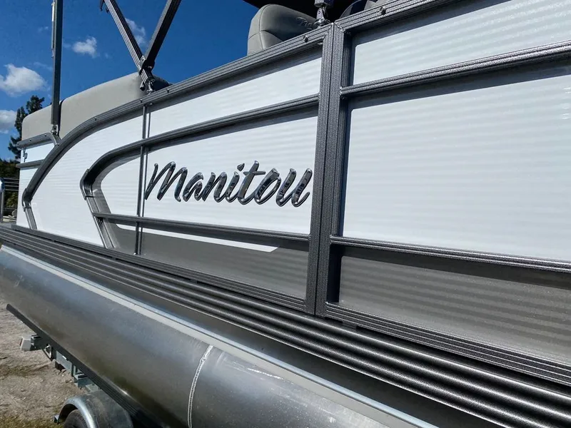 Slide: The Image of 2022 Manitou 23 Encore RF VP pontoon boat side view. - 7