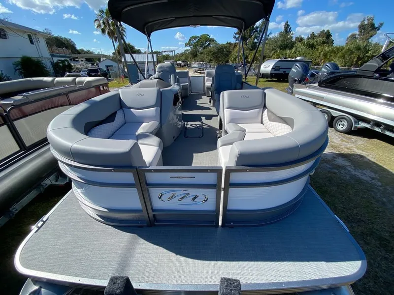 Slide: The Image of 2022 Manitou 23 Encore RF VP pontoon boat with spacious seating and canopy. - 8