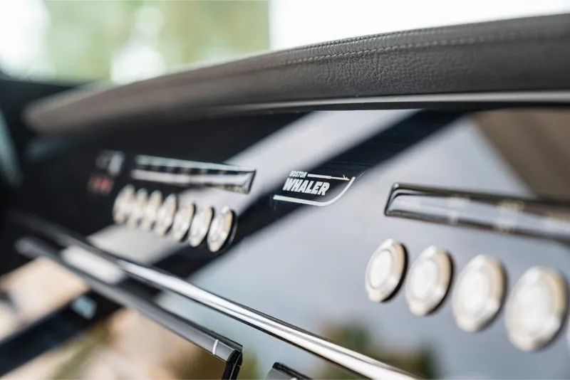Slide: The Image of Close-up of the control panel on a 2023 Boston Whaler 360 Outrage boat. - 11